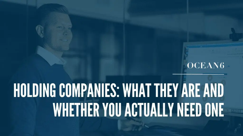 Entrepreneur reviewing finances and considering holding company structure in Canada