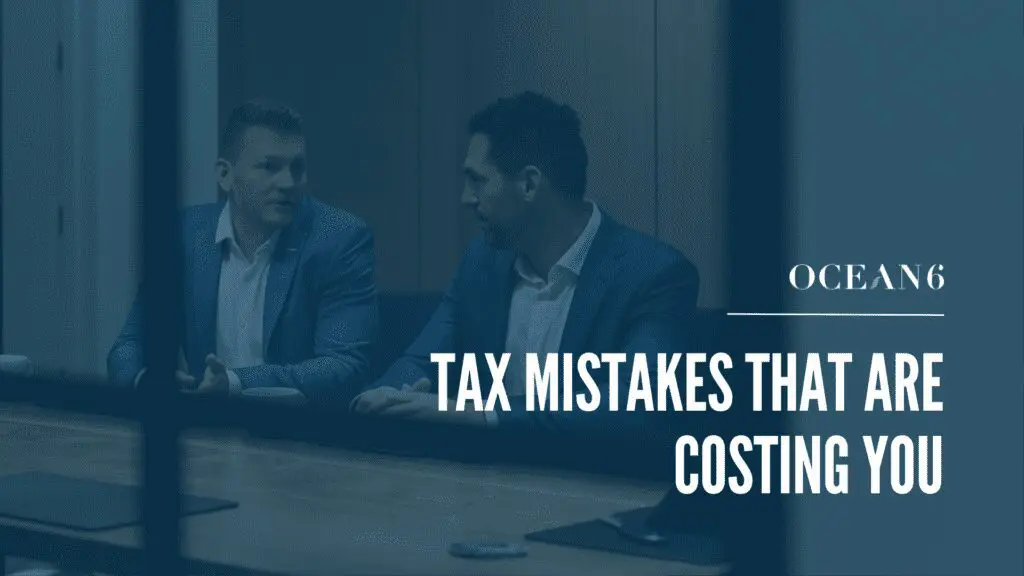 business owner reviewing finances and identifying tax mistakes in Canada