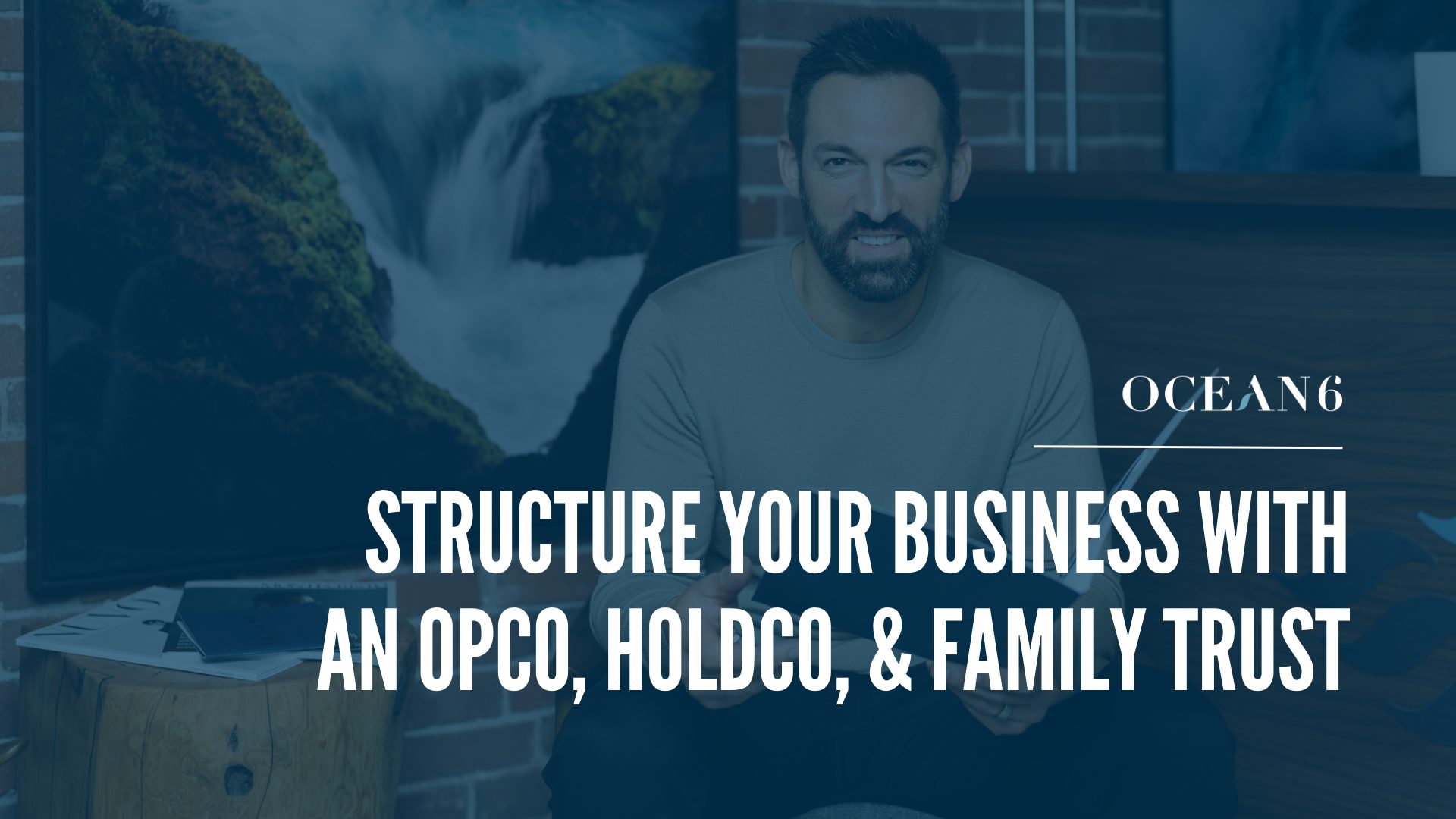 blog thumbnail with financial advisor sitting on a chair and holding a folder, smiling. The Difference Between an Operating Company, Holding Company, and Family Trust