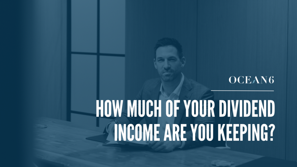 Financial advisor sitting in a boardroom looking through papers - blog on how is your dividend income taxed in Canada. Dividends, dividend income