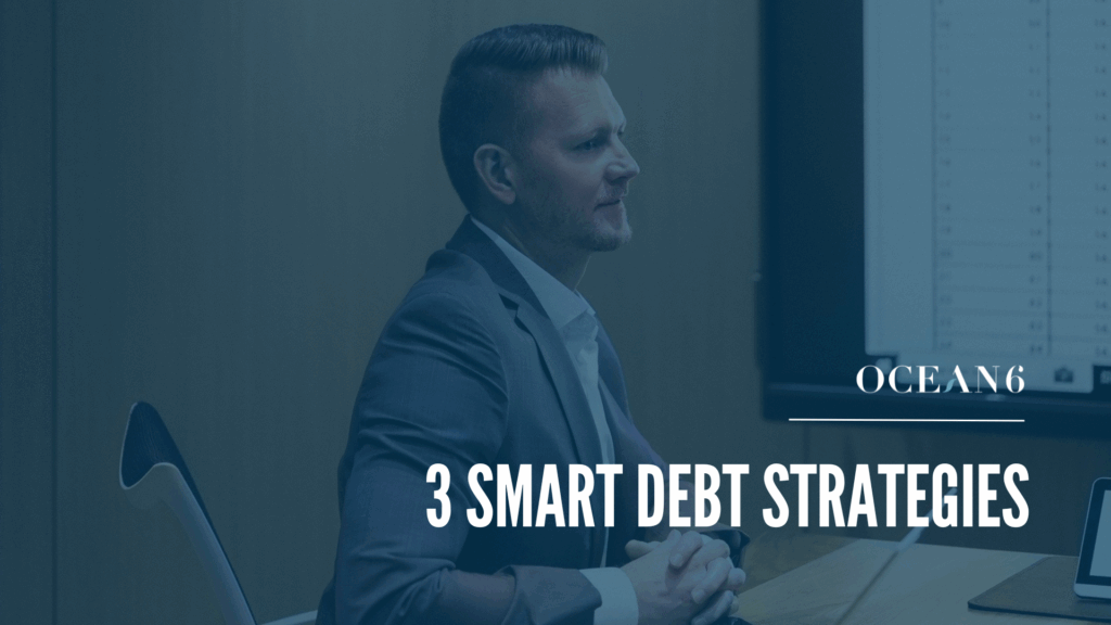 financial advisor sitting in a boardroom aT a desk smiling - blog thumbnail debt strategies: consolidation, optimization, or hybrid?