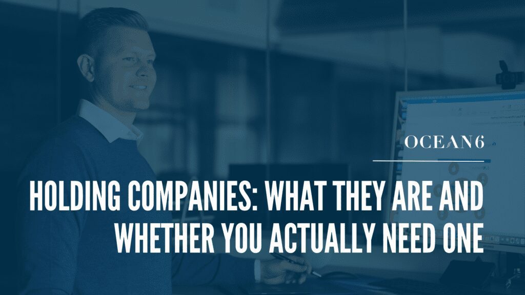 Entrepreneur reviewing finances and considering holding company structure in Canada